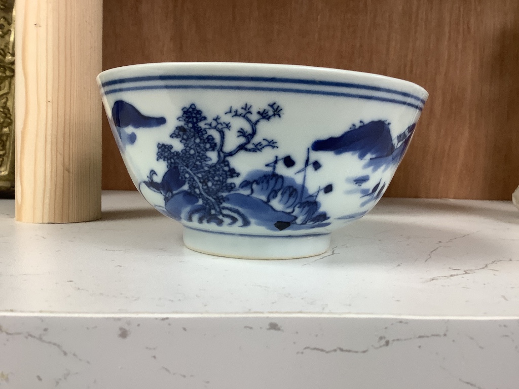 A Chinese blue and white footed porcelain bowl, Kangxi mark to underside, c1900, 12cm diameter 6cm high, together with a further hand painted famille rose, 15cm diameter, 7cm high